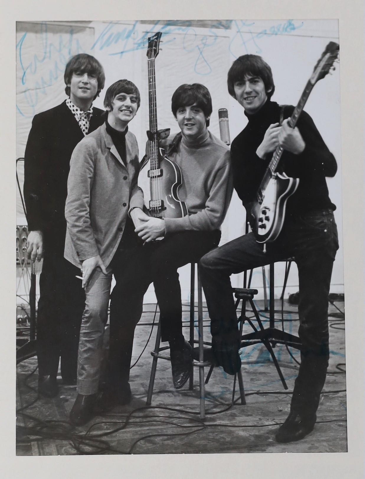 A Beatles signed photo in glazed frame, 23 x 17cm, bearing the signature of all four members with accompanying provenance in letter